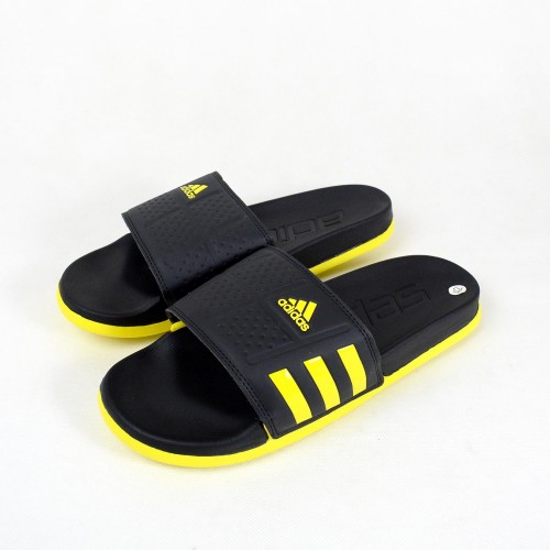 black and yellow adidas slides