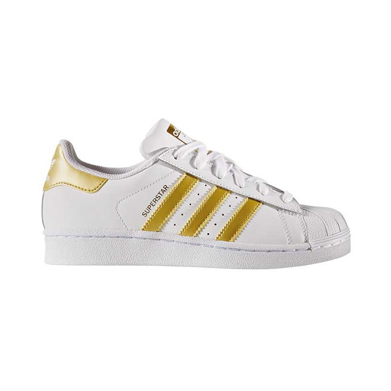 white shoes with gold stripes