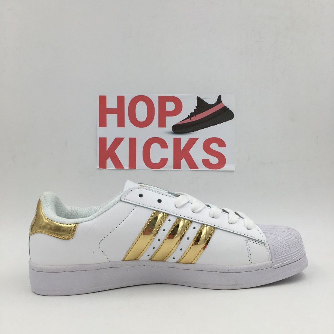 adidas all star gold stripes